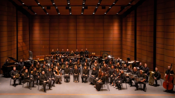 ASU Wind Symphony seated on a concert stage