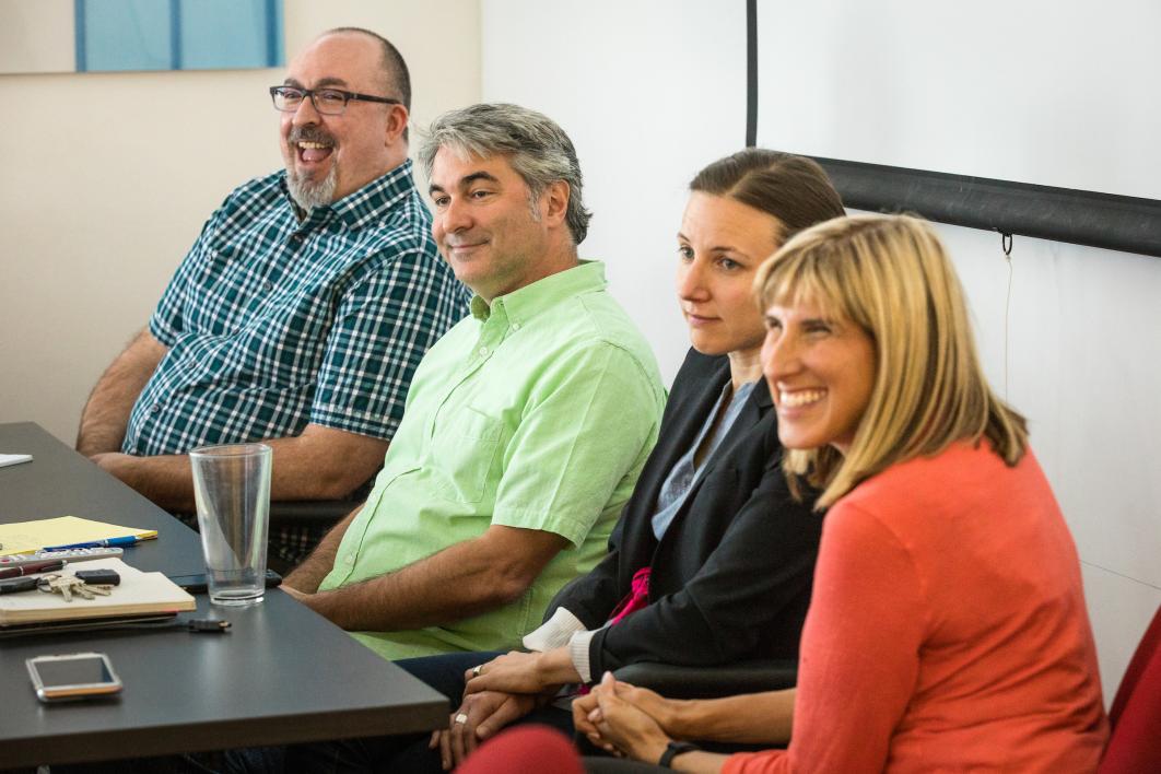 four ASU professors sitting at the front of a classroom