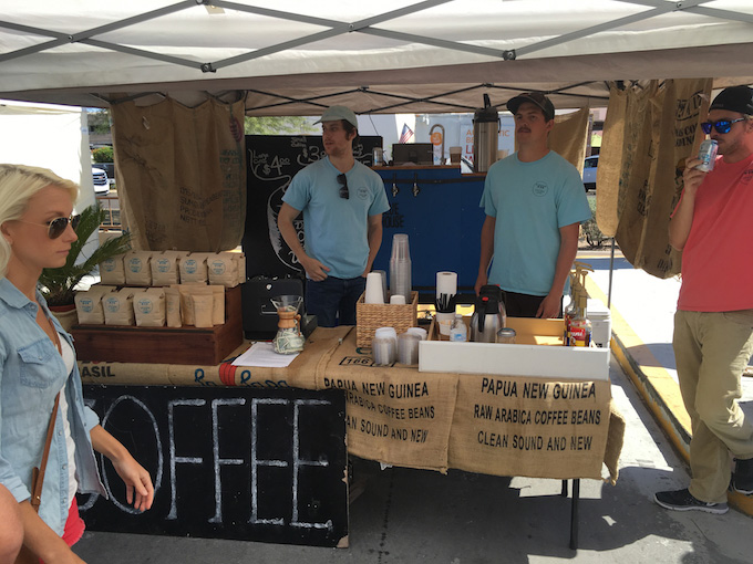 people selling coffee at farmers market