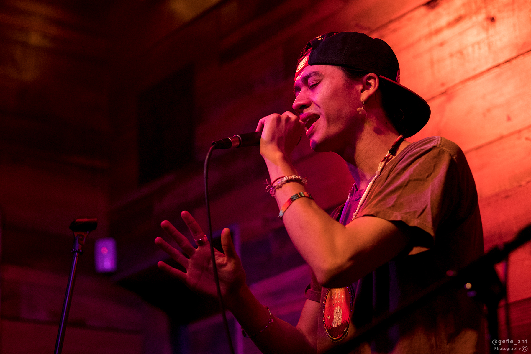 Young man singing and holding microphone