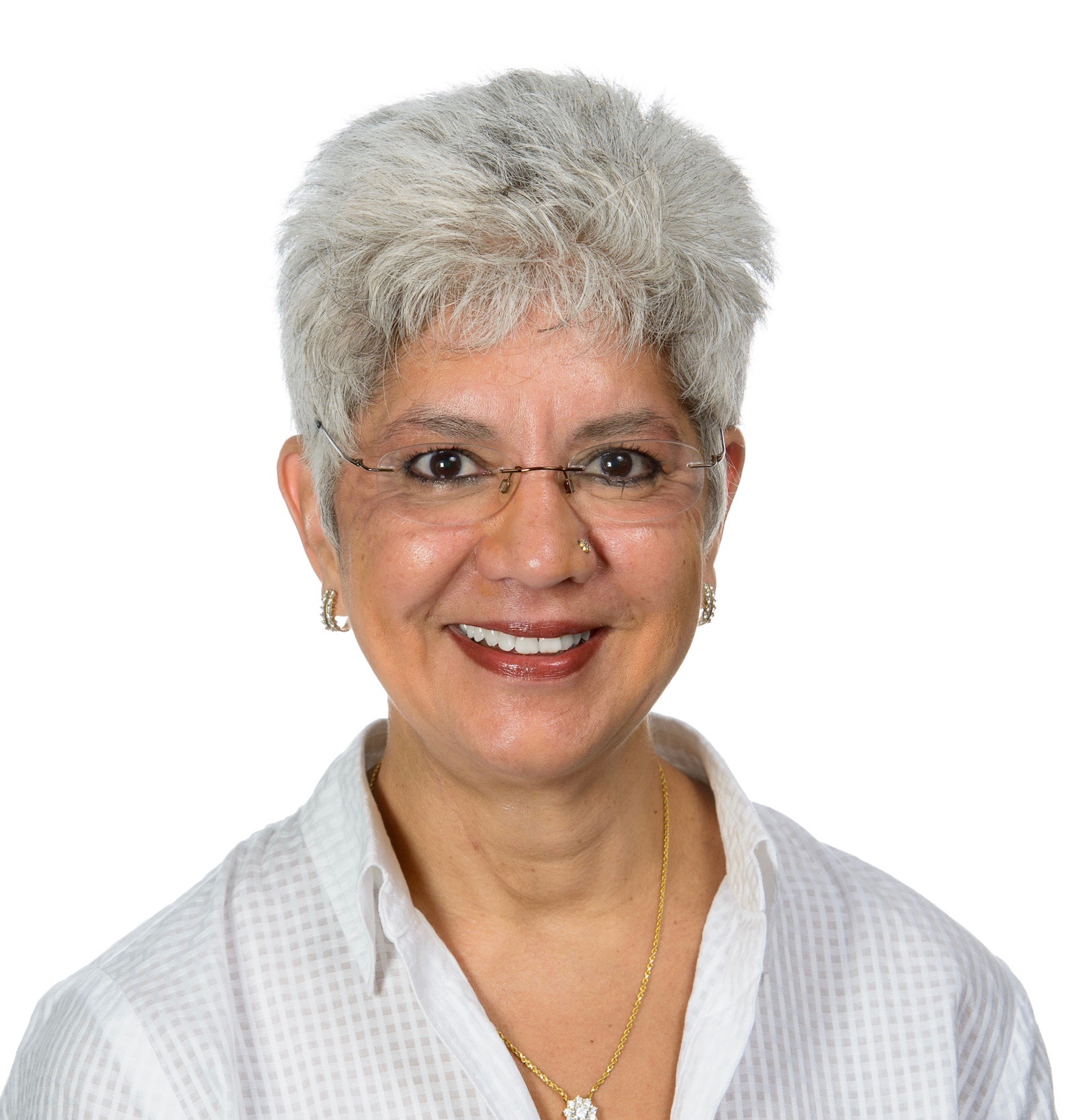 Woman in grey hair and glasses smiling