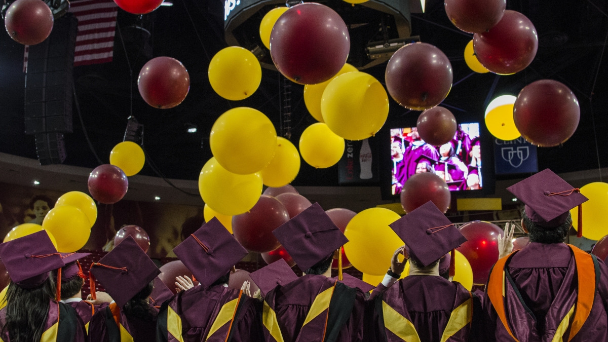 balloons dropping on students at graduation