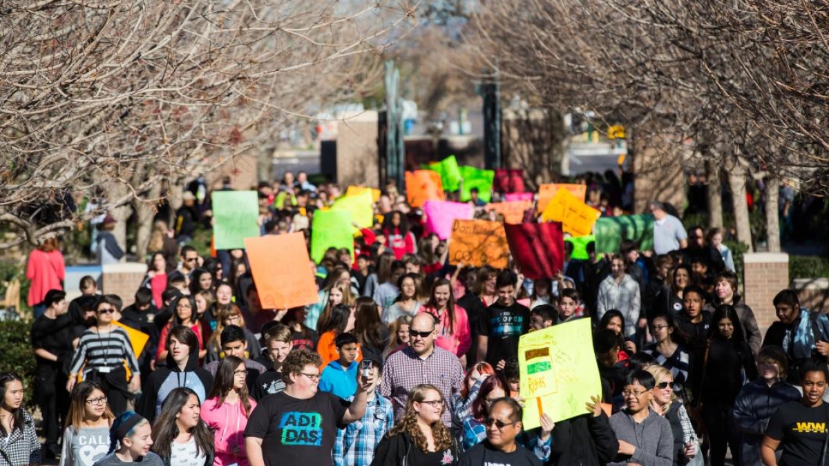 Students marching on ASU's West campus