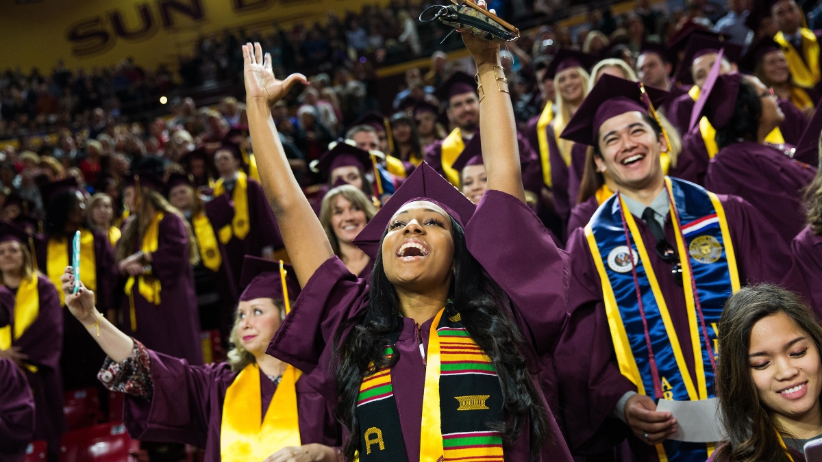 student celebrating at ASU commencement