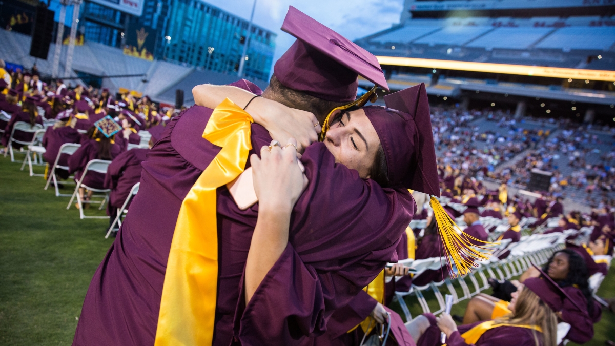 two people hugging at graduation