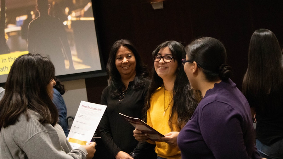 Women chat at an ASU Hispanic Mother Daughter Program event in 2019