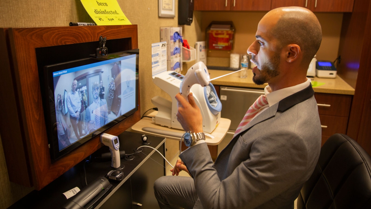 Arizona State University alumnus and AdviNOW Medical Product Director Tarek Saleh demonstrates the artificial-intelligence-enabled Akos Med Clinic