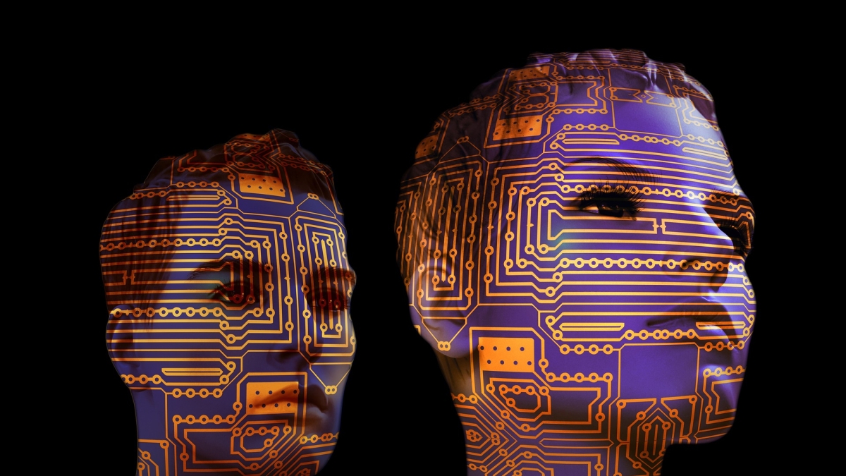two computer-generated faces with circuit boards design on top