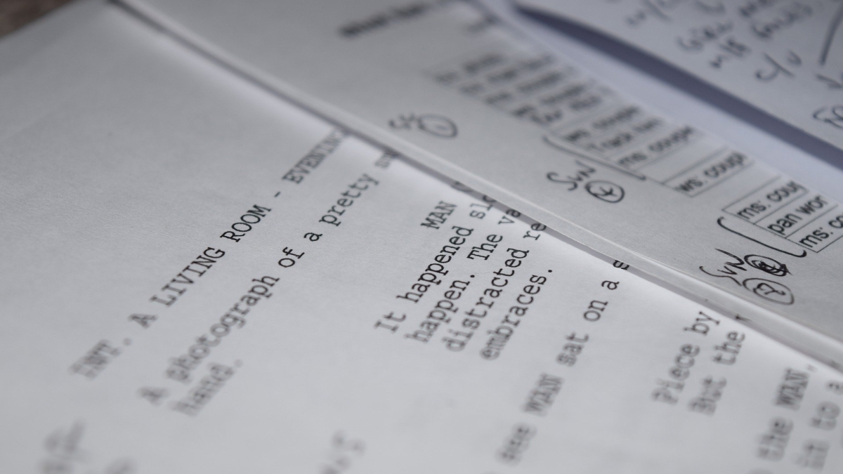 close-up photo of a screenplay typed on paper