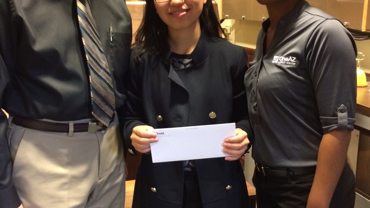 student holding carillon scholarship