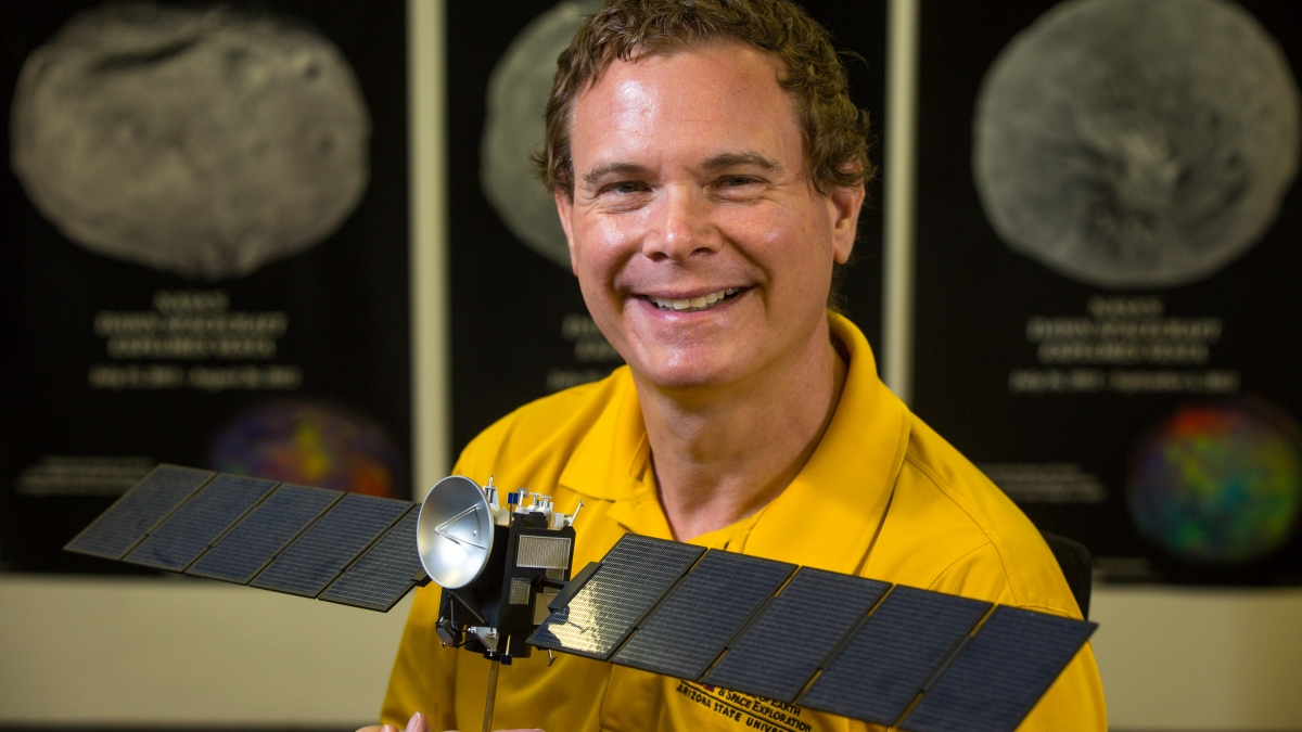 ASU associate research professor David Williams with model of Dawn spacecraft