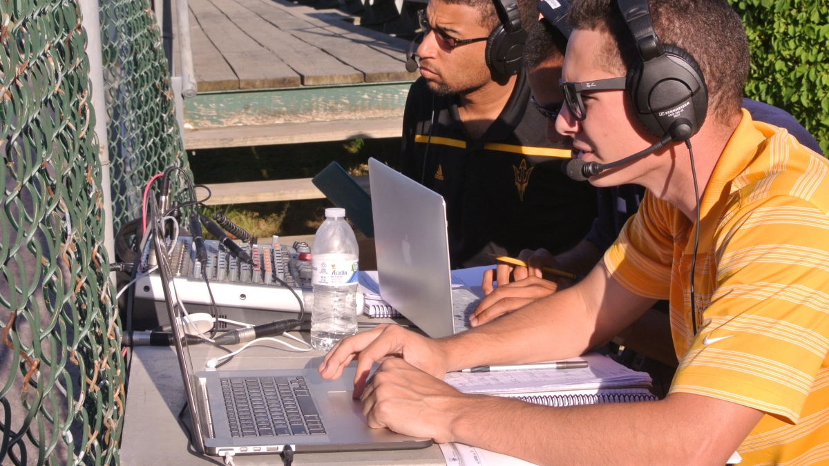 ASU broadcast students Andre Simms and Jake Garcia work on their game at the Cape Cod Baseball League. 