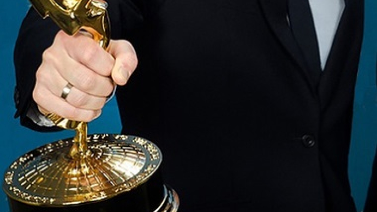 person holding Emmy award
