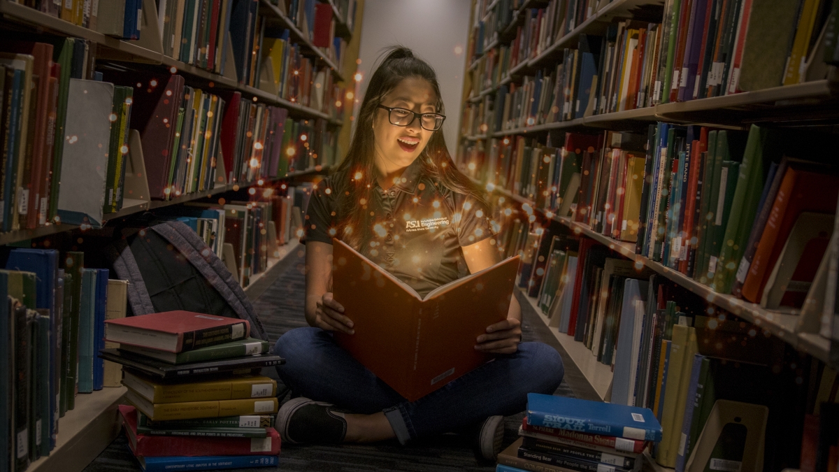 Girl in a library amazed by books