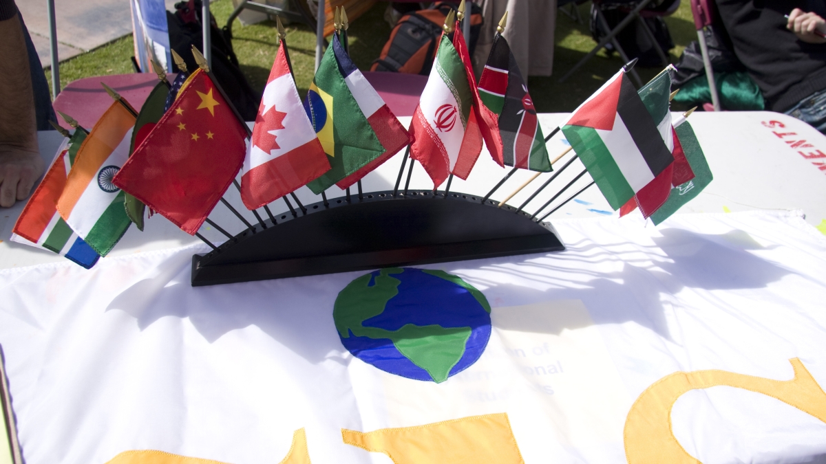 flags from different countries displayed on table