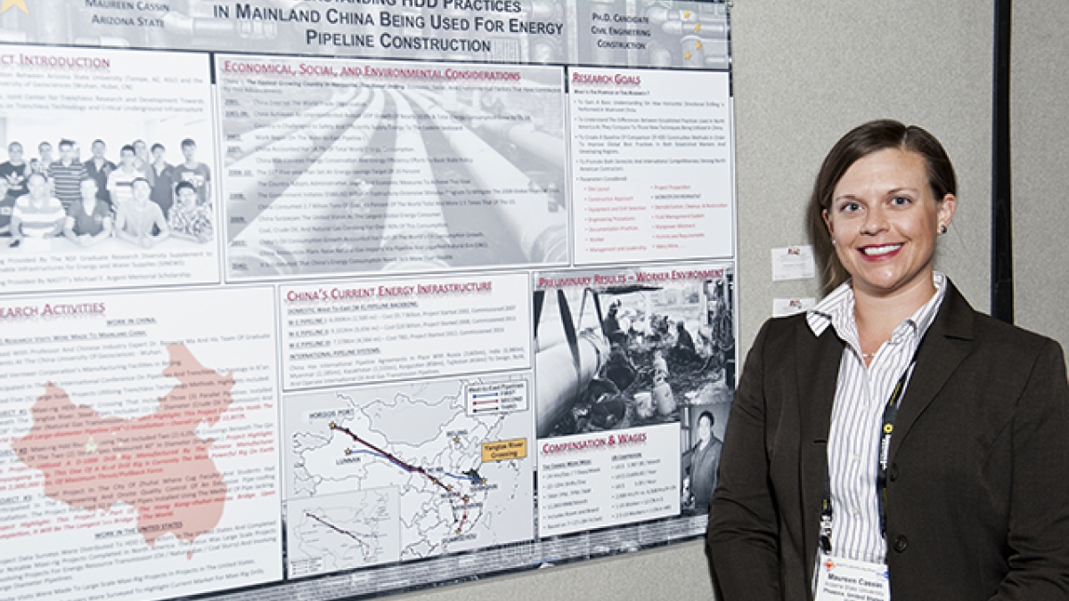 ASU doctoral student Maureen Cassin poses with her research poster