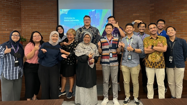 A group photo of ASU’s Jared Schoepf with representatives from Bina Nusantara University in Indonesia.