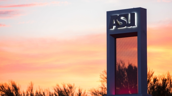 An ASU sign against a sunset sky