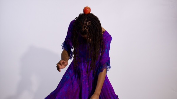 dancer with an apple on their head