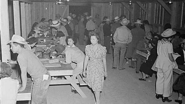 Photo shows people of Japanese decent registering upon arrival to an internment camp in Arizona.