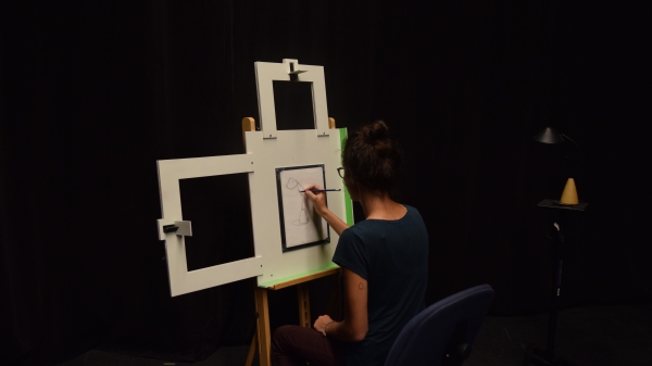 Photo of artist drawing