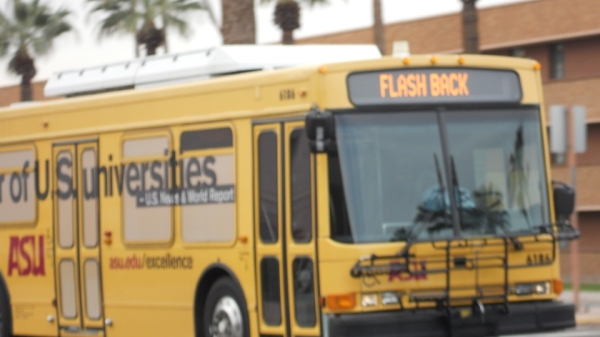 FLASH campus shuttle driving in front of ASU building