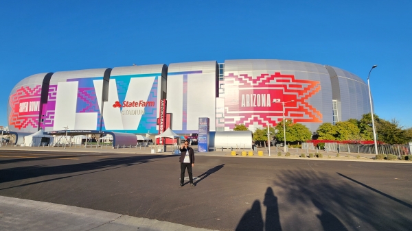 Exterior of State Farm stadium in Glendale, Arizona, painted with a sign for Super Bowl 57.
