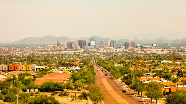 Aerial view of the Phoenix city skyline and the neighborhoods that surround it.