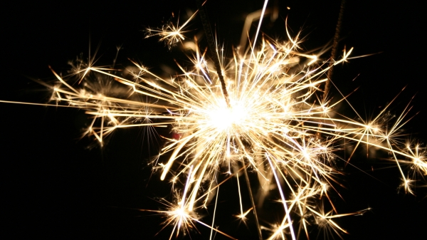 A sparkler surrounded by darkness.