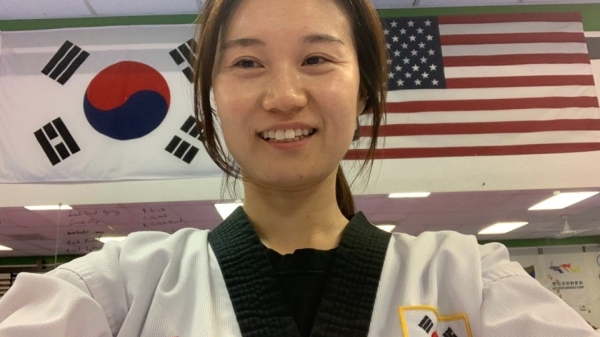 Graduating ASU student Young Wha Lee poses in her Taekwondo practice / Courtesy photo