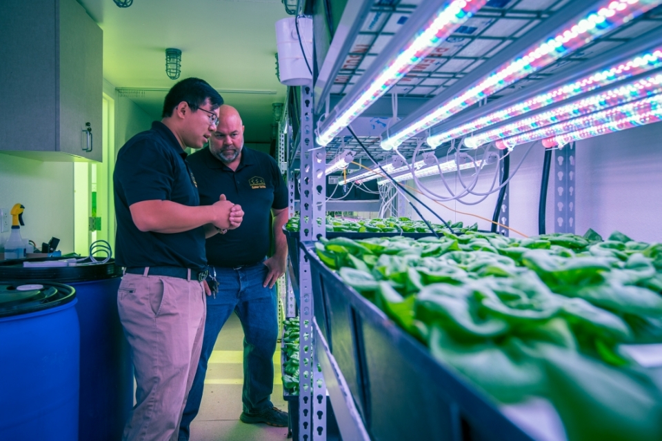 Zhihao Chen and Chad Geelhood inside vertical farm at ASU