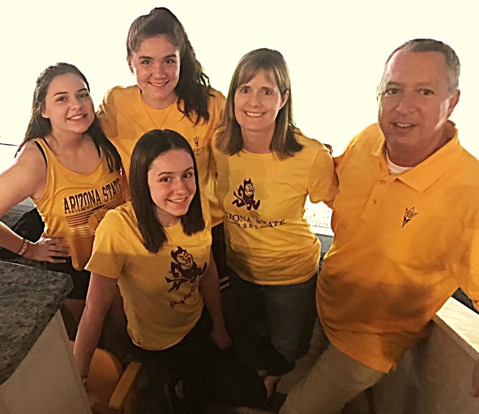 mother, father and their three daughters wearing ASU shirts