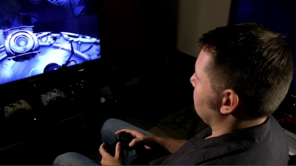 Courtesy image of Instructor Jeff Holmes playing videogames