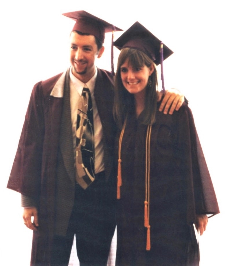 man and woman wearing graduation robes