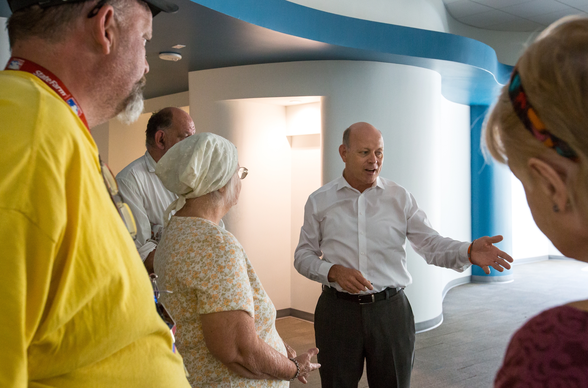 A group tours the renovated ground floor of the Westward Ho.